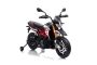 Električni dječji motocikl APRILIA DORSODURO 900, licencirani, 12 V, mekani kotači EVA, motor 2 x 18 W, 12V baterija, ovjes, metalni okvir, metalna vilica, pomoćni kotači, crveni